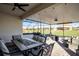 Spacious covered patio with seating area and outdoor dining at 2089 Camden Loop, Davenport, FL 33837