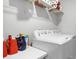 Bright laundry room with washer, dryer, and ample shelving at 2089 Camden Loop, Davenport, FL 33837