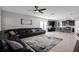 Open living room with sectional sofa and view into kitchen area at 2089 Camden Loop, Davenport, FL 33837