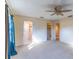 Large bedroom with multiple closets and doorways, plush carpeting, and a ceiling fan at 2460 Worthington Rd, Maitland, FL 32751