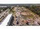 Aerial view of a townhome community under construction, showing surrounding area at 2595 Santorini Dr, Kissimmee, FL 34747