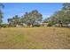 Large backyard with mature trees and detached workshop at 2770 Windsong Ln, St Cloud, FL 34772