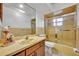Bathroom with vanity, mirror and tub shower combo at 2770 Windsong Ln, St Cloud, FL 34772