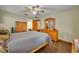 Spacious bedroom with wood floors and ceiling fan at 2770 Windsong Ln, St Cloud, FL 34772