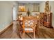 Bright dining room with wood table and chairs, wood floors at 2770 Windsong Ln, St Cloud, FL 34772