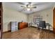 Bright home office features wood-look floors, built-in shelving and window at 2770 Windsong Ln, St Cloud, FL 34772