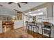 View of kitchen with breakfast bar, white cabinets and granite countertop at 2770 Windsong Ln, St Cloud, FL 34772