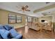 Spacious living room with tile floors, comfy couches, and lots of natural light at 2770 Windsong Ln, St Cloud, FL 34772