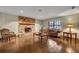 Living room with stone fireplace, wood floors, and comfy furniture at 2770 Windsong Ln, St Cloud, FL 34772