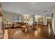 Spacious living area with hardwood floors and a view into the kitchen at 2770 Windsong Ln, St Cloud, FL 34772
