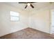 Bedroom featuring a ceiling fan, closet, and natural light at 3115 Avenue U Nw, Winter Haven, FL 33881