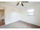 Cozy bedroom with neutral carpet, a ceiling fan, and ample natural light at 3115 Avenue U Nw, Winter Haven, FL 33881