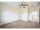 Bedroom featuring a closet, ceiling fan, and doorway view to another room at 3115 Avenue U Nw, Winter Haven, FL 33881