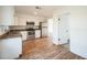Well-lit kitchen featuring stainless steel appliances, granite countertops and new white cabinets at 3115 Avenue U Nw, Winter Haven, FL 33881