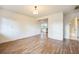 The open floorplan has modern flooring throughout the living room to the kitchen at 3115 Avenue U Nw, Winter Haven, FL 33881