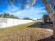 Large backyard with a white vinyl fence at 3291 Pawleys N Loop, St Cloud, FL 34769