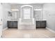 Elegant bathroom with a soaking tub and double vanity at 3291 Pawleys N Loop, St Cloud, FL 34769