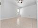 Spacious bedroom with tile floors and a window with blinds at 3291 Pawleys N Loop, St Cloud, FL 34769