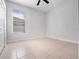 Spacious bedroom with tile floors and a large window with blinds at 3291 Pawleys N Loop, St Cloud, FL 34769