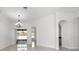 Dining room with chandelier and access to the backyard at 3291 Pawleys N Loop, St Cloud, FL 34769