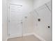 Laundry room with shelving and a door at 3291 Pawleys N Loop, St Cloud, FL 34769
