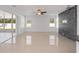 Bright living room with tile floors and sliding glass doors leading to a patio at 3291 Pawleys N Loop, St Cloud, FL 34769