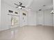 Spacious living room with tile floors and ceiling fan at 3291 Pawleys N Loop, St Cloud, FL 34769