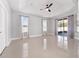 Main bedroom with sliding doors leading to a patio at 3291 Pawleys N Loop, St Cloud, FL 34769