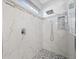 Modern walk-in shower with marble tile and rain shower head at 3291 Pawleys N Loop, St Cloud, FL 34769
