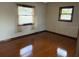 Bright bedroom with hardwood floors and large windows at 3458 Balsam Dr, Winter Park, FL 32792