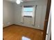Cozy bedroom with wood floors and neutral-toned window treatments at 3458 Balsam Dr, Winter Park, FL 32792