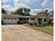 Ranch-style home with attached garage and mature landscaping at 3458 Balsam Dr, Winter Park, FL 32792