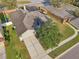 Aerial view of the home, its green lawn, and the surrounding neighborhood at 369 Belhaven Falls Dr, Ocoee, FL 34761