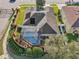 Aerial view of home showcasing the lawn, landscaping, hardscaping, pool, and fencing at 369 Belhaven Falls Dr, Ocoee, FL 34761