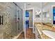 Bathroom with updated shower, granite vanity, and view to dining room at 369 Belhaven Falls Dr, Ocoee, FL 34761
