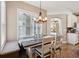 Dining area features a window seat and modern light fixture at 369 Belhaven Falls Dr, Ocoee, FL 34761