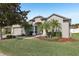 Charming single-story home with well-manicured landscaping and a welcoming front entrance at 369 Belhaven Falls Dr, Ocoee, FL 34761