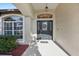 Inviting front entrance features a decorative door with a wreath and a 'hello' doormat at 369 Belhaven Falls Dr, Ocoee, FL 34761