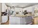 Bright kitchen with granite countertops, stainless steel appliances, and modern cabinetry at 369 Belhaven Falls Dr, Ocoee, FL 34761