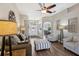 Stylish living room with hardwood floors, neutral decor, and ample seating at 369 Belhaven Falls Dr, Ocoee, FL 34761