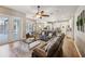 Open floor plan featuring a living room, dining area, and kitchen at 369 Belhaven Falls Dr, Ocoee, FL 34761