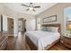Spacious main bedroom with wood floors and en-suite bathroom at 369 Belhaven Falls Dr, Ocoee, FL 34761