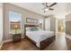 Bright main bedroom with wood floors and ample natural light at 369 Belhaven Falls Dr, Ocoee, FL 34761