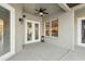 Covered patio with ceiling fan and view to backyard at 369 Belhaven Falls Dr, Ocoee, FL 34761