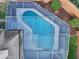 Top down view of a screened in pool featuring a light blue interior finish at 369 Belhaven Falls Dr, Ocoee, FL 34761