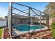 Aerial view of screened pool in landscaped backyard at 369 Belhaven Falls Dr, Ocoee, FL 34761
