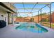 Backyard featuring screened pool with brick perimeter at 369 Belhaven Falls Dr, Ocoee, FL 34761