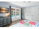 Comfortable bedroom featuring a quilt and views of the pool area at 4154 Equestrian Ln, Windermere, FL 34786