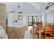 Open-concept dining room area featuring hardwood floors and access to the backyard at 4154 Equestrian Ln, Windermere, FL 34786