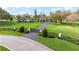 An impressive estate with an automatic gate, a long driveway and mature trees at 4154 Equestrian Ln, Windermere, FL 34786